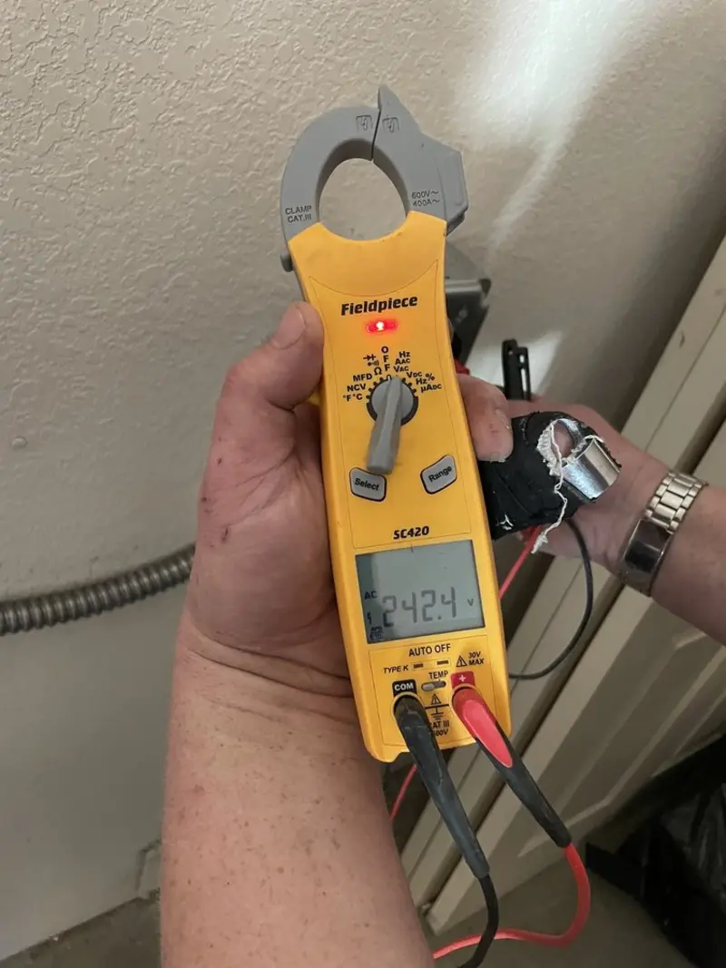 Voltage testing with clamp meter during Aluminum Wiring Replacement in West St. Paul